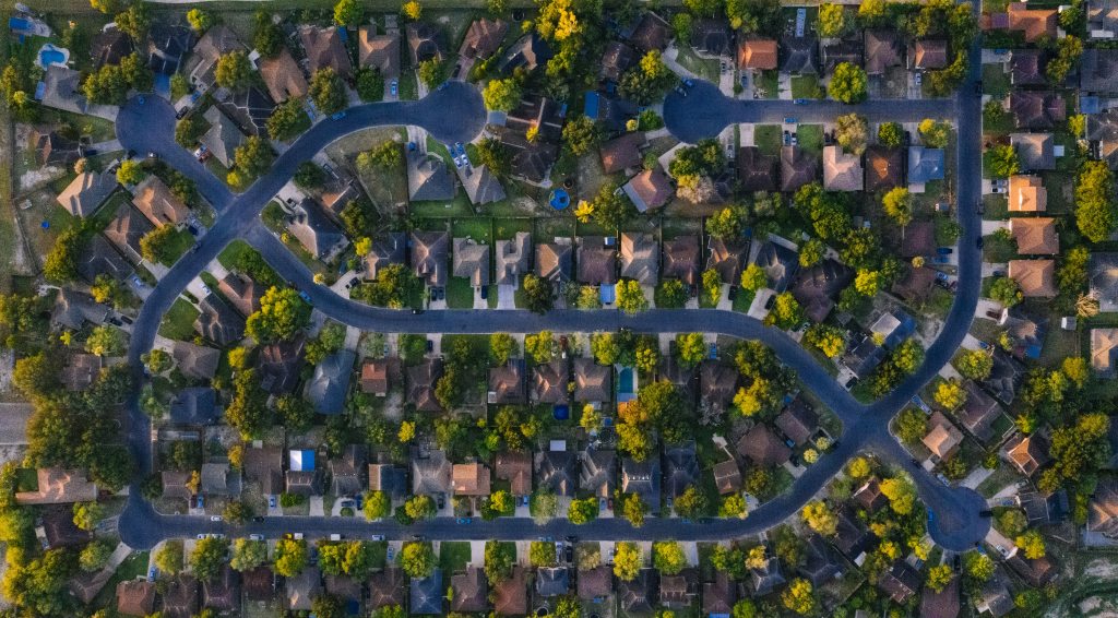 Birdseye view of a residentional neighborhood to illustrate real estate market