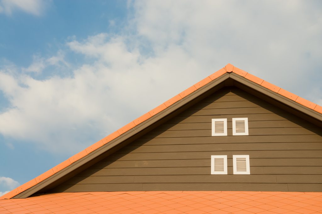 Picture of a roofline and the sky representing a home for sale and the real estate market in the Albuquerque area