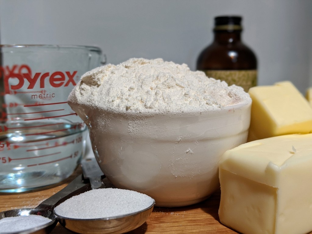 All of the pie crust ingredients together including flour, sugar, anf butter