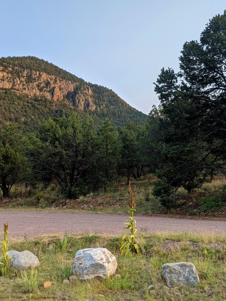 View of the Magdalena Mountains from the South. Shot taken during the sunset so colors are vibrant and the mountains are reddish.